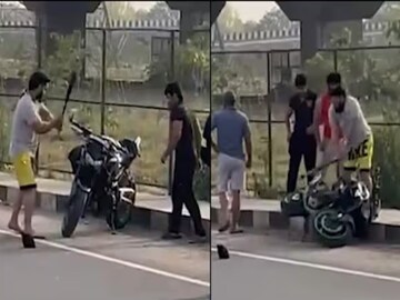 গাড়ি থেকে নেমে বাইক আরোহীকে বেসবল ব্যাট দিয়ে মারধর ! (Photo Courtesy: IANS)