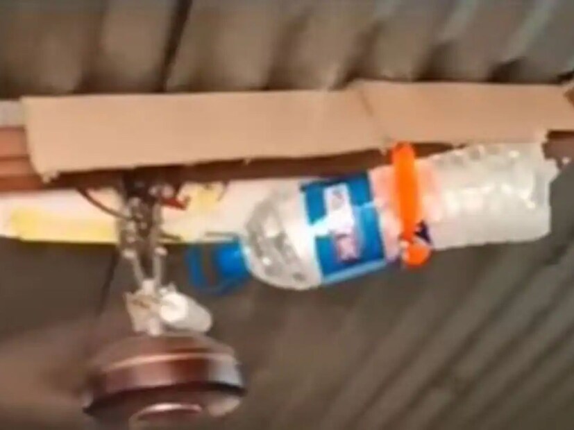 ভাইরাল হওয়া ভিডিওতে দেখা যাচ্ছে যে, ছাদের সিলিং ফ্যানের পাশে একটি জলের বোতল ভাল করে আটকে দেওয়া হয়েছে। বোতলে ছোট্ট ফুটো করা। এবার ওই ফুটো দিয়ে ফোঁটা ফোঁটা জল পড়ছে সিলিং ফ&#x200d;্যানে। 