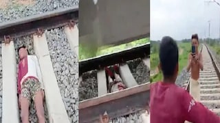 চলন্ত ট্রেনের নীচে শুয়ে পড়ে রিল তৈরির উন্মাদনা! তিন নাবালককে হেফাজতে নিল পুলিশ 