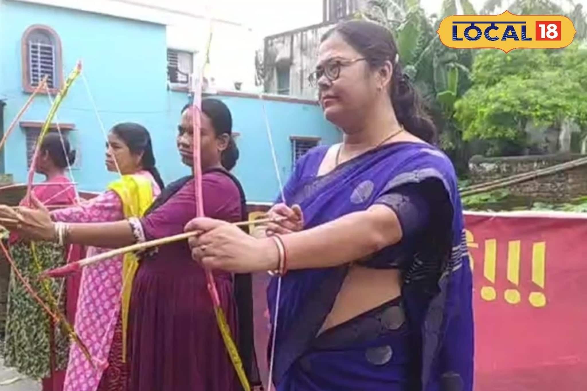 কেউ শাড়ি পরে তো কেউ সালোয়ার-কামিজ, তবে সবার হাতে হাতে তীর-ধনুক, কেন?