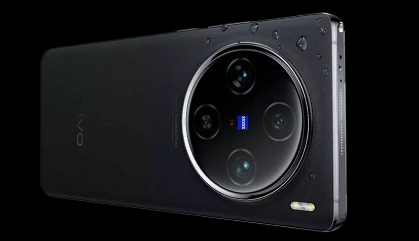Vivo X100 Pro-র ফিচার: এই ফ্ল্যাগশিপ স্মার্টফোনটির ফিচার এবং স্পেসিফিকেশনের বিষয়ে আলোচনা করে নেওয়া যাক। Vivo X100 Pro 5G-তে রয়েছে ৬.৭৮ ইঞ্চির LTPO কার্ভড AMOLED ডিসপ্লে। এর সঙ্গে মিলবে ১২০ হার্ৎজ রিফ্রেশ রেট সাপোর্ট। এই ফোনটি MediaTek-এর Dimensity 9300 প্রসেসর দ্বারা চালিত হয়। এটিতে মিলবে 16GB of RAM এবং 512GB স্টোরেজ।