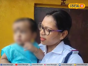 পুলিশ কর্মীর কোলে এসএসসি পরীক্ষার্থীর সন্তান