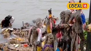 গঙ্গায় প্রতিমা নিরঞ্জন। গঙ্গায় প্রতিমা নিরঞ্জন।