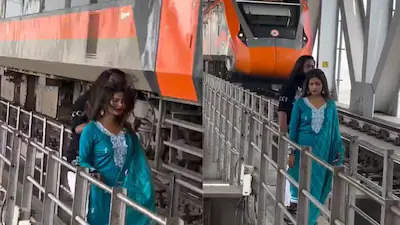 ভাইরাল ভিডিওতে দেখা যাচ্ছে, একজন পুরুষ এবং মহিলা একটি ভোজপুরি গান বাজানো একটি রিলের শুটিং করছেন, আর বন্দে ভারত এক্সপ্রেস তাদের পাশ দিয়ে ঝড়ের বেগে ছুটে যাচ্ছে।