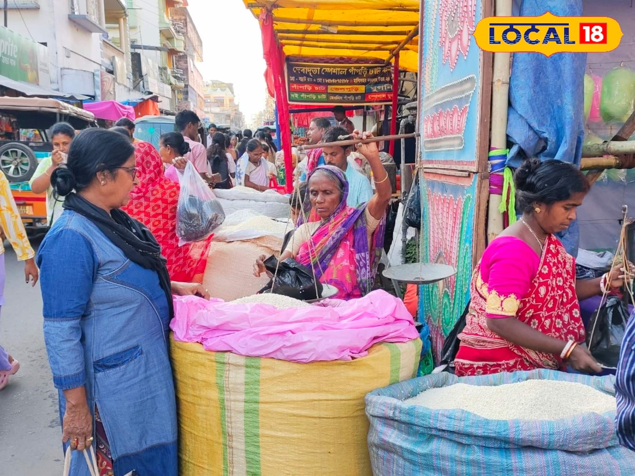 ২০০-৩০০ টাকা কেজি, স্বাদে-গুণে ভরপুর বিশেষ খই! ঢেলে বিক্রি হচ্ছে মালদহের কার্তিক মেলায়