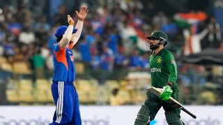 Pakistan's Shadab Khan, right, leaves the ground after losing his wicket as India's Abhishek Sharma celebrates during the T20 World Cup cricket match between India and Pakistan in Colombo, Sri Lanka, Sunday, Feb. 15, 2026. (AP Photo/Eranga Jayawardena)