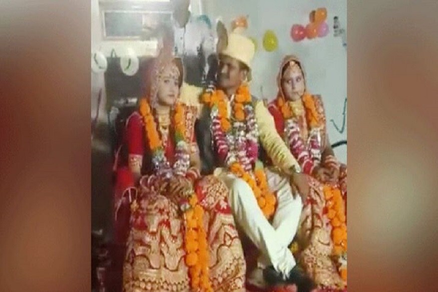 ભિંડ જિલ્લાના ગુલાવલી ગામમાં 26 નવેમ્બરના દિવસે થયેલા લગ્નમાં 35 વર્ષીય દિલીપ ઉર્ફે દીપુ પરિહારે પહેલા 22 વર્ષીય સાળી રચના સાથે ફેરા દીધા અને પછી એક જ સ્ટેજ ઉપર નવી પત્ની સાથે 28 વર્ષીય સરપંચ પત્ની વિનીતા દેવીને પણ વરમાળા પહેરાવી હતી. દિલીપ અને વિનીતાના આશરે નવ વર્ષ પહેલા લગ્ન થયા હતા. બંનેને ત્રણ બાળકો પણ છે. ભિંડ જિલ્લાના ગુલાવલી ગામમાં 26 નવેમ્બરના દિવસે થયેલા લગ્નમાં 35 વર્ષીય દિલીપ ઉર્ફે દીપુ પરિહારે પહેલા 22 વર્ષીય સાળી રચના સાથે ફેરા દીધા અને પછી એક જ સ્ટેજ ઉપર નવી પત્ની સાથે 28 વર્ષીય સરપંચ પત્ની વિનીતા દેવીને પણ વરમાળા પહેરાવી હતી. દિલીપ અને વિનીતાના આશરે નવ વર્ષ પહેલા લગ્ન થયા હતા. બંનેને ત્રણ બાળકો પણ છે.