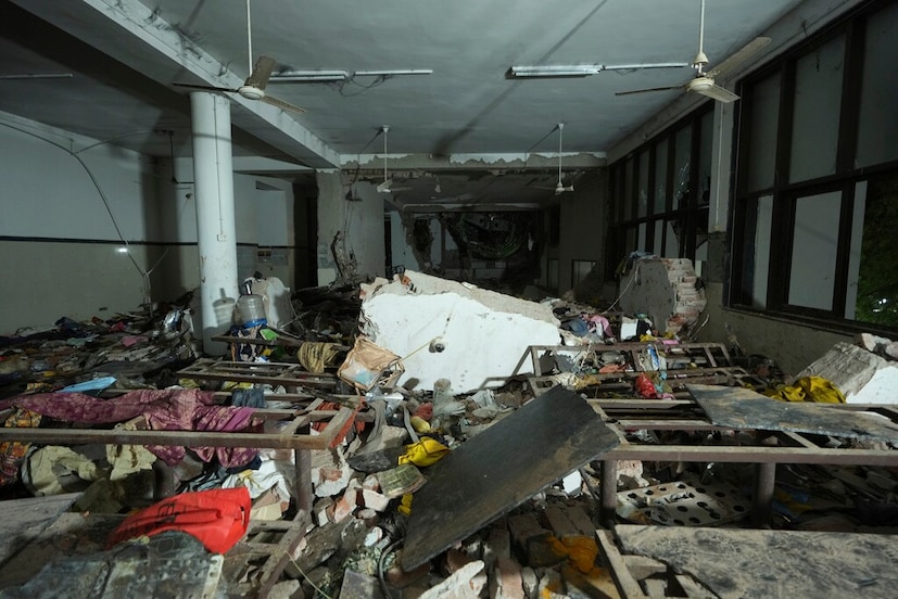 Inside View of A Canteen Building Where the Tail of the Airplane Stuck at the site of an airplane that crashed in India's Northwestern City of Ahmedabad, June 12, 2025 (APP Photo/Ajit Solanki)
