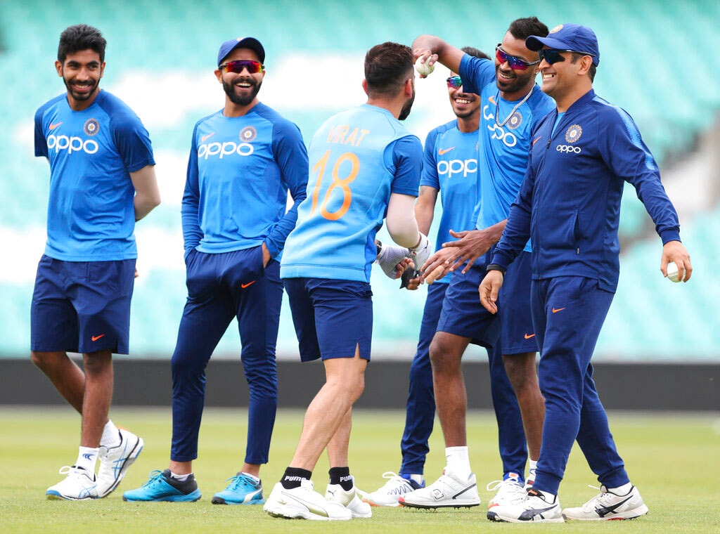 India's captain Virat Kohli, third left, shares a light moment with teammates during a training session at The Oval in London, Friday, May 24, 2019. The Cricket World Cup starts on Thursday May 30. (AP Photo/Aijaz Rahi)