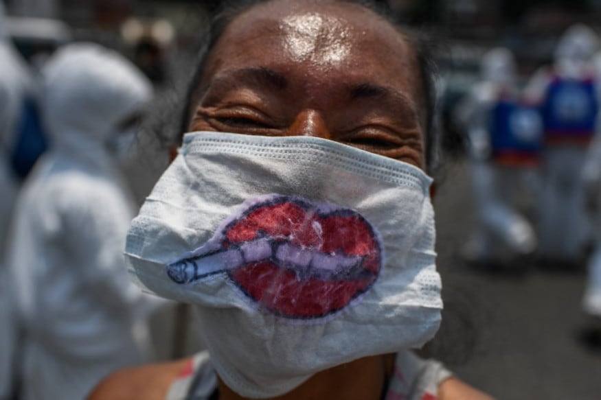 A woman wears a face mask as she shops in a market as a preventive measure against the new coronavirus, COVID-19, at the Petare neighbourhood Caracas. (Image: AFP) A woman wears a face mask as she shops in a market as a preventive measure against the new coronavirus, COVID-19, at the Petare neighbourhood Caracas. (Image: AFP)