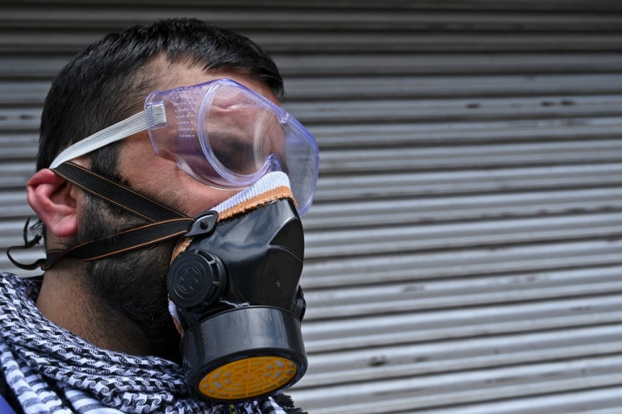 A man wearing a facemask and googles stands along a street during the government-imposed nationwide lockdown as a preventive measure against the spread of the COVID-19 coronavirus outskirts of Srinagar. (Image: AFP)<span style="color: #333333; font-size: 1rem;"> </span> A man wearing a facemask and googles stands along a street during the government-imposed nationwide lockdown as a preventive measure against the spread of the COVID-19 coronavirus outskirts of Srinagar. (Image: AFP)<span style="color: #333333; font-size: 1rem;"> </span>