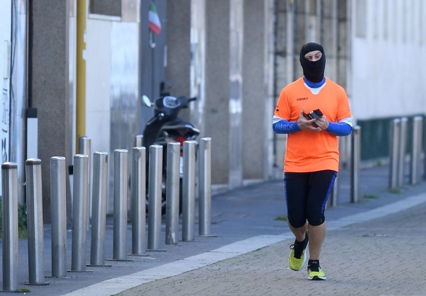 A jogger wearing a protective face mask runs the street, as the spread of the coronavirus disease (COVID-19) continues, in Milan, Italy. (Image: Reuters) A jogger wearing a protective face mask runs the street, as the spread of the coronavirus disease (COVID-19) continues, in Milan, Italy. (Image: Reuters)