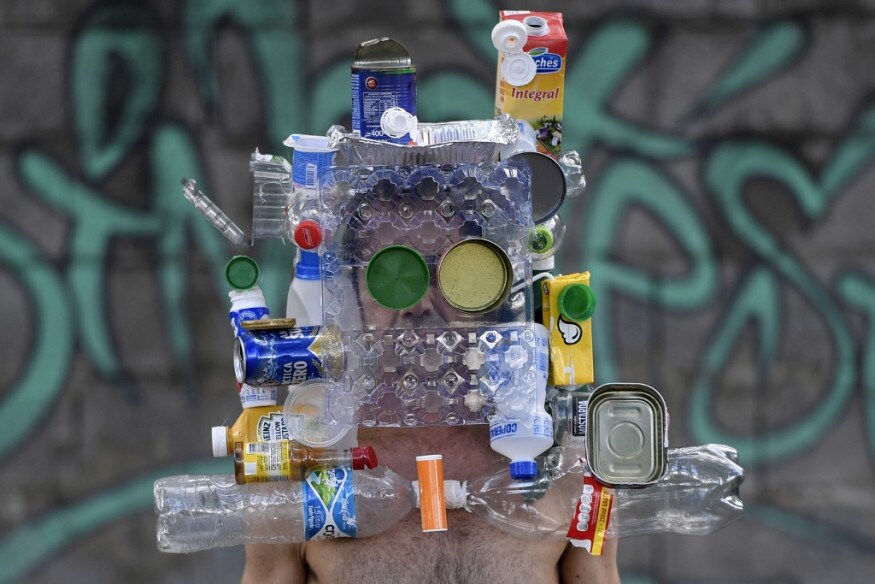 Brazilian fashion photographer Marcio Rodrigues wears a mask made with recyclable bottles, cans and boxes after over 20 days in which these garbage items were not collected because of the quarantine imposed to control the spread of the new coronavirus (COVID-19), in Belo Horizonte, Brazil. (Image: AFP) Brazilian fashion photographer Marcio Rodrigues wears a mask made with recyclable bottles, cans and boxes after over 20 days in which these garbage items were not collected because of the quarantine imposed to control the spread of the new coronavirus (COVID-19), in Belo Horizonte, Brazil. (Image: AFP)