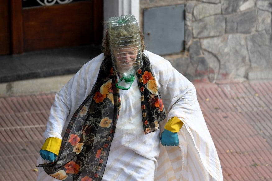 A woman wears a plastic water bottle to cover her face amid the spread of the coronavirus, COVID-19 disease, in Montevideo. (Image: AFP) A woman wears a plastic water bottle to cover her face amid the spread of the coronavirus, COVID-19 disease, in Montevideo. (Image: AFP)