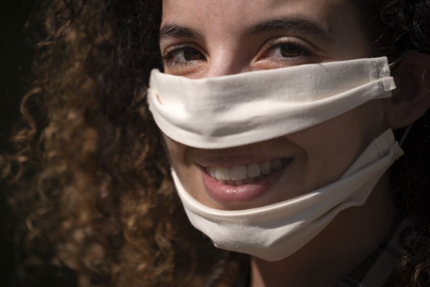 French leather creator Anissa Mekrabech wearing the protective face mask she created for the deaf and the hearing-impaired people poses in Toulouse, southern France during a strict lockdown across France to stop the spread of COVID-19, caused by the novel coronavirus. (Image: AFP) French leather creator Anissa Mekrabech wearing the protective face mask she created for the deaf and the hearing-impaired people poses in Toulouse, southern France during a strict lockdown across France to stop the spread of COVID-19, caused by the novel coronavirus. (Image: AFP)