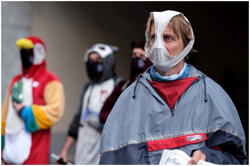 A man is seen using underwear as a face mask during a protest against the lockdown imposed to slow the spread of the coronavirus disease (COVID-19), in Berlin, Germany. (Image: Reuters) A man is seen using underwear as a face mask during a protest against the lockdown imposed to slow the spread of the coronavirus disease (COVID-19), in Berlin, Germany. (Image: Reuters)