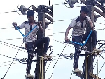 மின்வயரை துண்டிக்கும் இளைஞர்