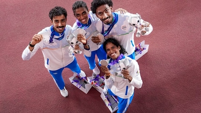 Nagoya: Clockwise from left, India's TS Manu, MR Poovamma, Vishal TK and Vithya Ramraj pose for photographers after winning silver medal in the mixed 4x400m relay race at the 20th Asian Games, in Nago