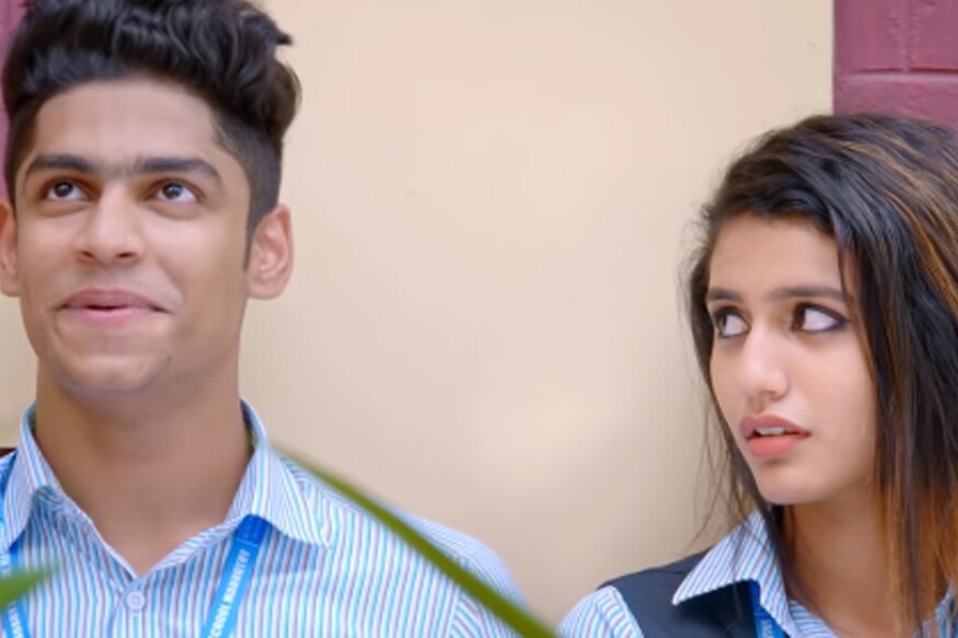 Priya Prakash Varrier's Oru Adaar Love lip lock video with Roshan Abdul Rauf gets trolled in social media pk.. ఒరు అదార్ లవ్ సినిమాతో సినిమా ఇండస్ట్రీకి పరిచయం కాబోతుంది ప్రియా ప్రకాశ్ వారియర్. ఆమె అదృష్టం బాగుండి ఒక్కసారి కన్నుగొట్టి ఇండియా మొత్తాన్ని ఫిదా చేసింది. అయితే ఈమె నటించిన సినిమాలు ఇప్పుడు వరసగా వివాదాల్లో ఇరుక్కుంటున్నాయి. priya prakash varrier lip lock,priya varrier lip lock scene trolled in social media,priya prakash varrier lip lock scene,oru adaar love priya prakash varrier lip lock scene,Priya Prakash Varrier Roshan Abdul Rauf lip lock scene,priya prakash varrier oru adaar love movie,lovers day movie lip lock scene,priya prakash varrier lovers day movie lip lock scene,ప్రియా ప్రకాశ్ వారియర్ లిప్ లాక్,ప్రియా ప్రకాశ్ వారియర్ లవర్స్ డే లిప్ లాక్ సీన్,ప్రియా వారియర్ లిప్ లాక్ సీన్పై ట్రోలింగ్,ప్రియా వారియర్ ఒరు ఆదార్ లవ్ తెలుగు సినిమా
