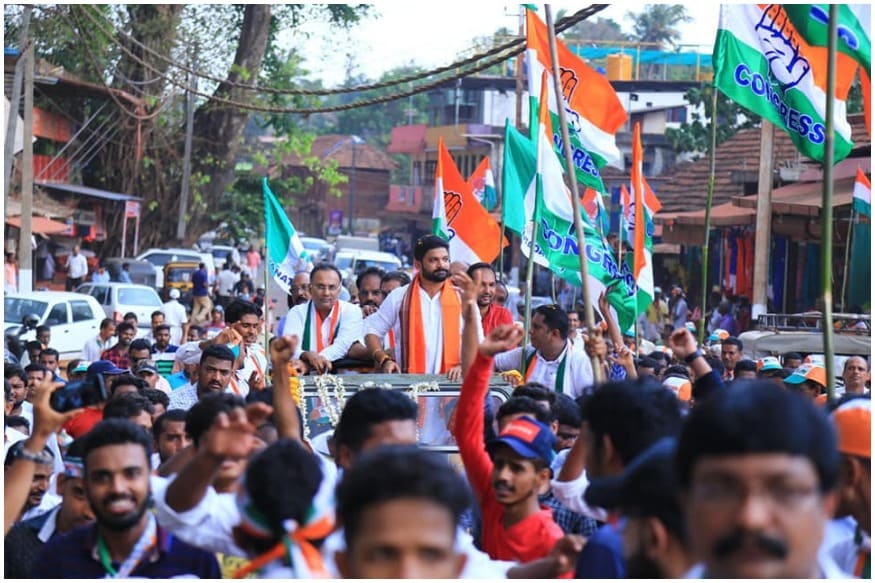 కాషాయ కండువాలతో ప్రచారం చేస్తున్న కాంగ్రెస్ అభ్యర్థి మిథున్ (Image : Facebook)