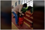 ఖాళీ గ్యాస్ సిలిండర్‌లో దాచి మద్యం అక్రమ రవాణా...వైరల్ వీడియో