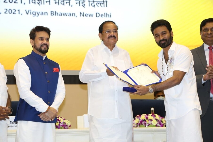  67వ జాతీయ చలన చిత్ర అవార్డులో భాగంగా  2019 యేడాదికి గాను జాతీయ ఉత్తమ నటుడు విభాగంలో ‘అసురన్’ అనే తమిళ సినిమాలోని నటనకు ధనుశ్... ‘భోంస్లే ’ అనే హిందీ సినిమాలోని యాక్టింగ్‌కు మనోజ్ బాజ్‌పేయ్ సంయుక్తంగా అవార్డు అందుకున్నారు. తాజాగా వీళ్లిద్దరు ఈ అవార్డును వెంకయ్య నాయుడు చేతులు మీదుగా తీసుకోనున్నారు.(Twitter/Photo)