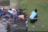డ్రైనేజీలో 10,100రూపాయల నోట్ల కట్టలు..ఏరుకునేందుకు ఎగబడ్డారు..వీడియో ఇదిగో