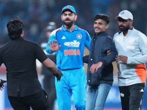 Virat Kohli fan hug Rajkot ODI, security official slaps Virat Kohli fan, India vs New Zealand Rajkot security breach, Virat Kohli fan video viral, match official hits cricket fan, Kohli pleads with security for fan, Rajkot stadium security failure, Virat Kohli fan incident video, Indian cricket fans security breach today, Virat Kohli kind gesture to fan, security breach at cricket stadium India, IND vs NZ 2nd ODI 2026 highlights, T20 World Cup 2026 security concerns, విరాట్ కోహ్లీ అభిమాని వీడియో, రాజ్‌కోట్ వన్డే భద్రతా లోపం, కోహ్లీ అభిమానిపై అధికారి దాడి, ఇండియా వర్సెస్ న్యూజిలాండ్ వన్డే అప్‌డేట్స్, విరాట్ కోహ్లీ ఫ్యాన్ హగ్