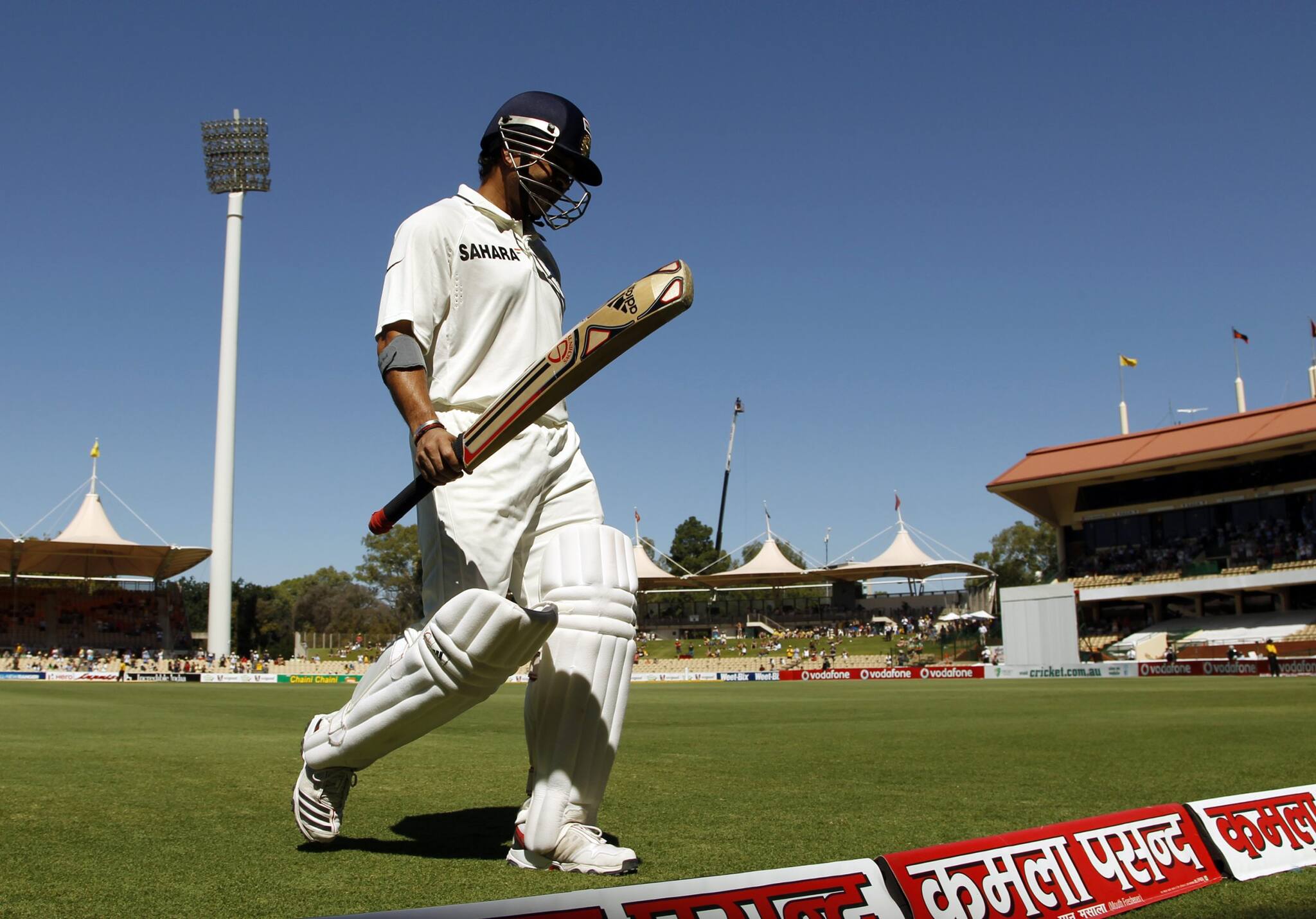 Sachin Tendulkar of India walks off after losing his wicket during the fourth day of their fourth test cricket match against Australia in Adelaide