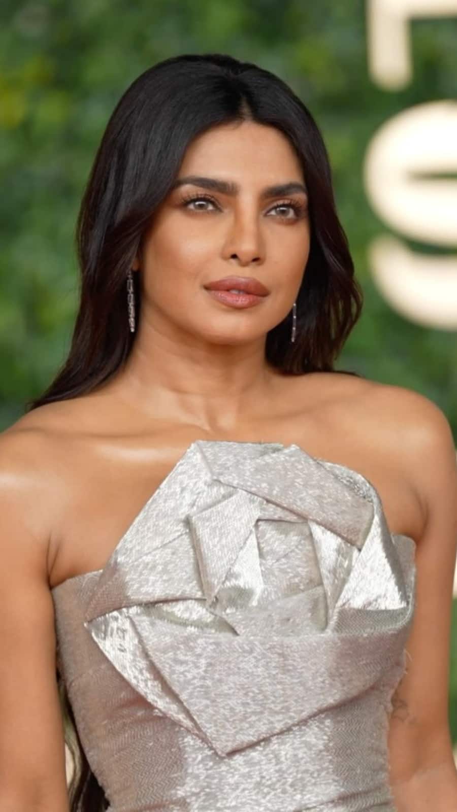 priyanka chopra silver dress Priyanka Chopra Goes Backless in Silver Halter Dress