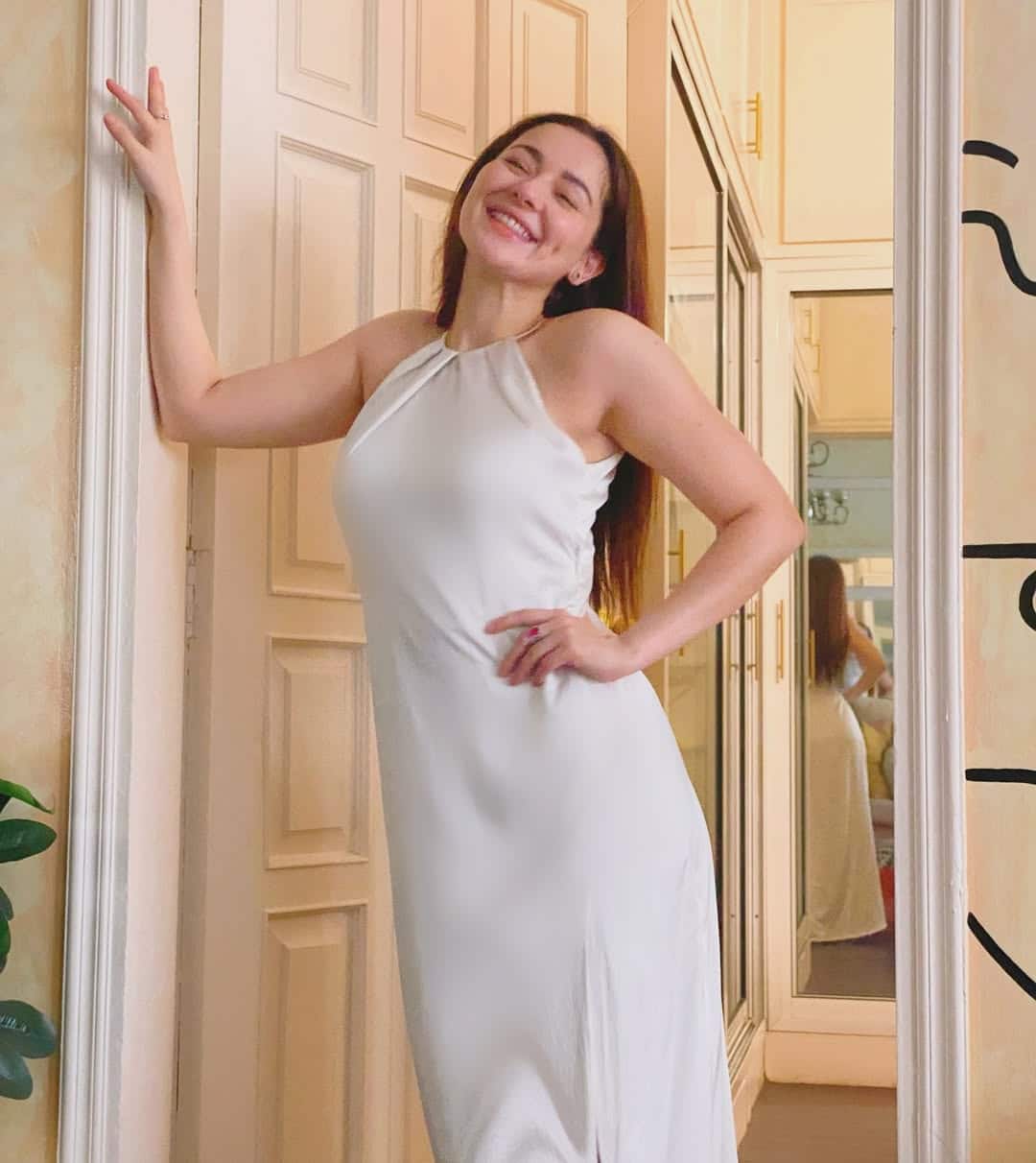 hania amir white silk dress The lovely Hania Amir looks ravishing in this outfit from our Chloe pret  collection. Made in silk, the ensemble has hand applied crystal and pearl  beading on the shirt and trouser with