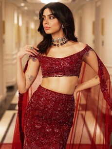 Khushi Kapoor mesmerises in rose-red lehenga with veil