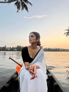 Malavika Mohanan stuns in saree on Kerala boat ride