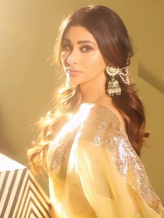 Mouni Roy Stuns in Golden Saree with Traditional Jewellery